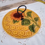 Vintage yellow earthenware cheese dish with sunflower decor and wrought iron handle