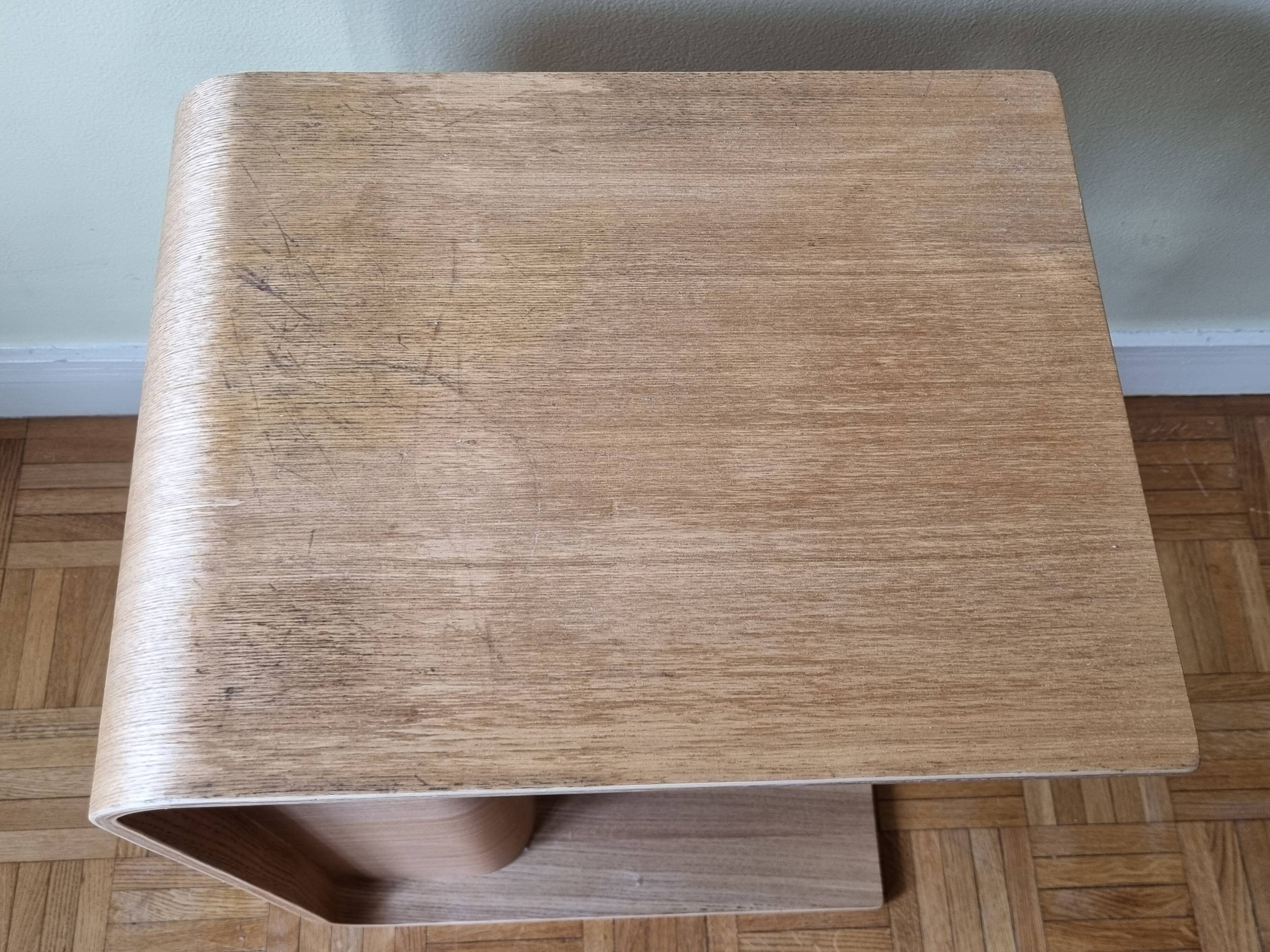 Boone coffee table in curved wood produced by Habitat, design