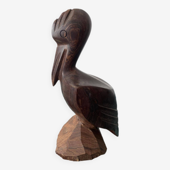 Carved wooden pelican. Dark wood.