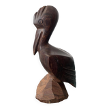 Carved wooden pelican. Dark wood.