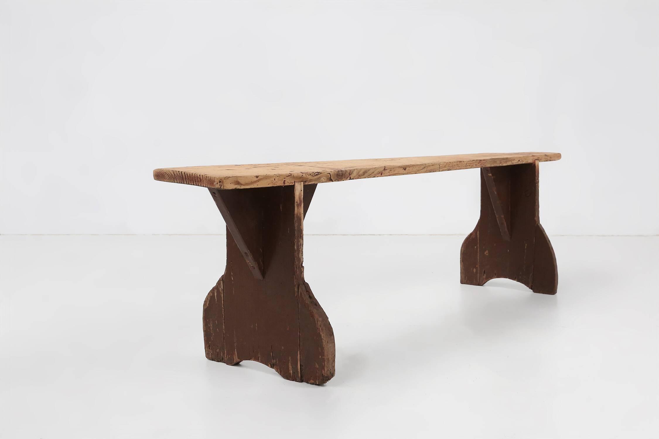 Rustic wooden bench in with brown painted feet, France ca. 1890