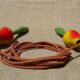 Old wooden jump rope toy painted in the shape of pear fruit ref