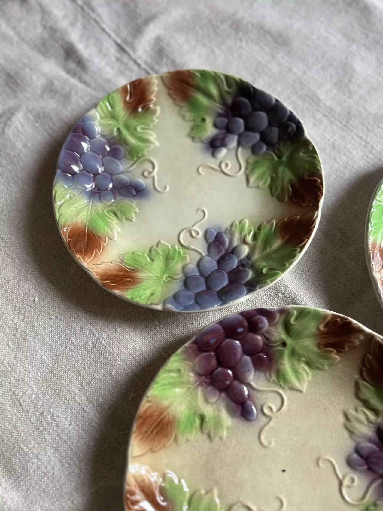 Set of eight flat dessert plates in barbotine earthenware with grape decoration – circa 1900.