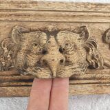 Natural wood pediment with bunches of grapes