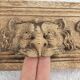 Natural wood pediment with bunches of grapes