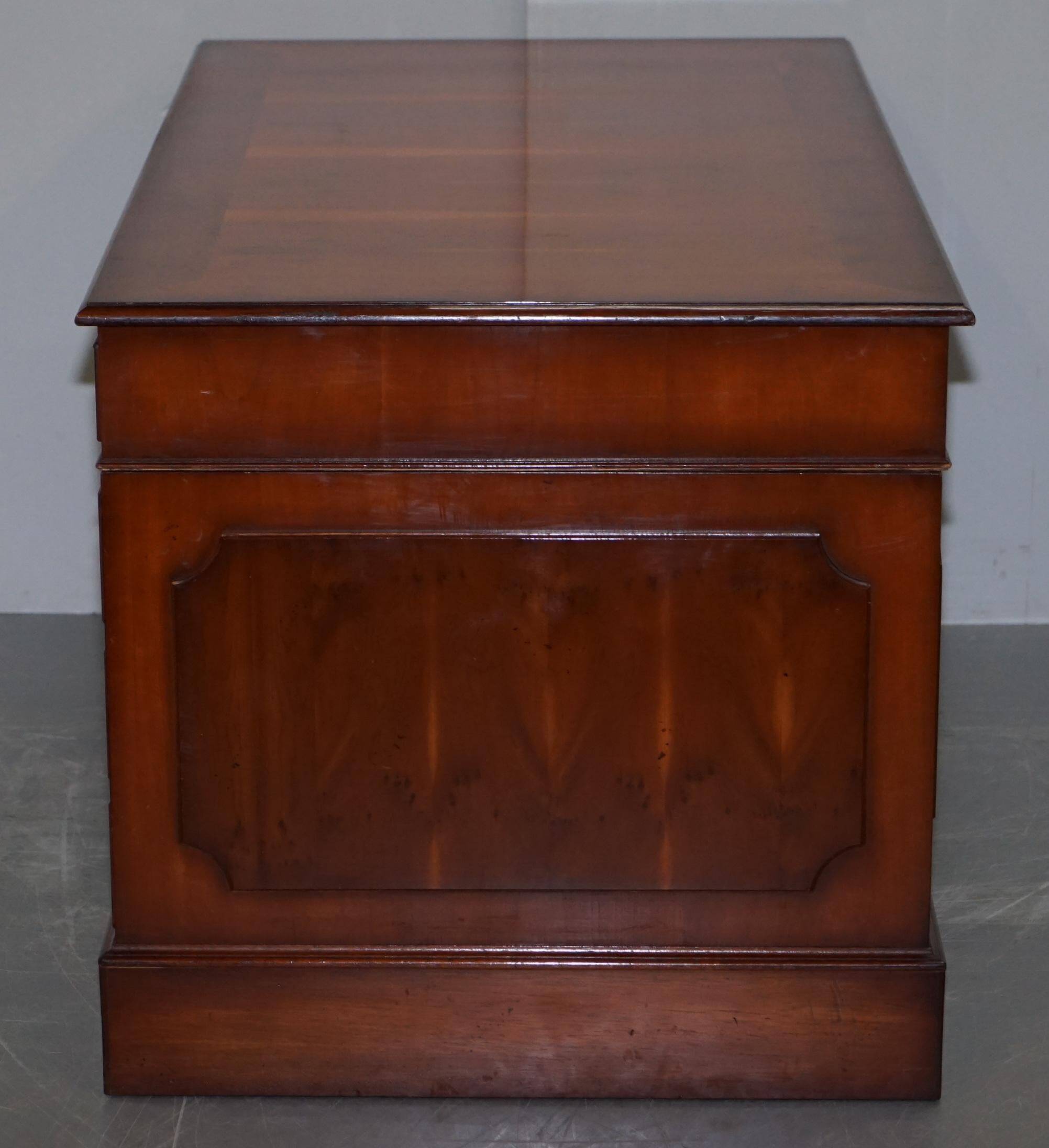 Partner desk with double pedestal in burr yew wood with decorated top.