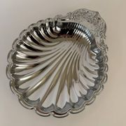 Large silver-plated serving dish in the shape of a vintage shell.