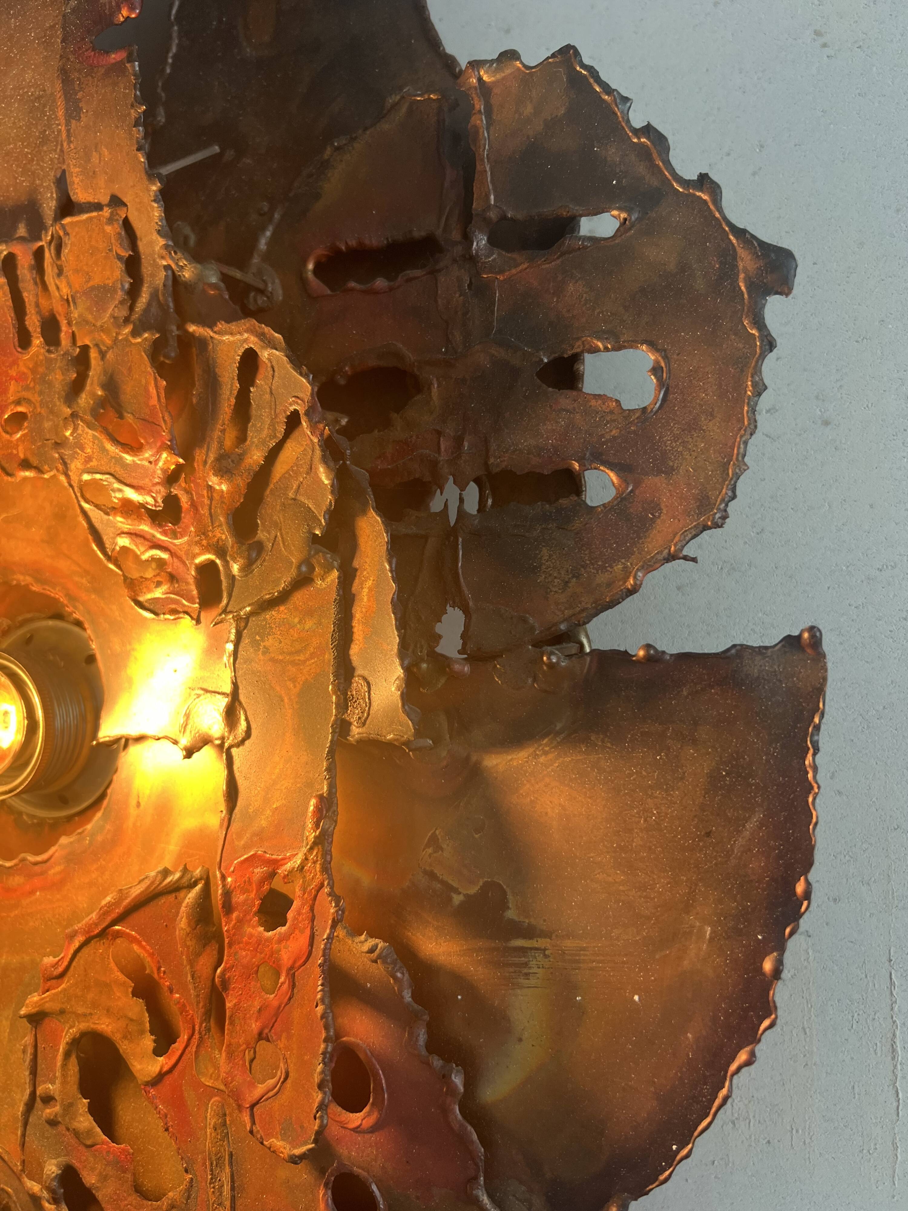 Raw expressive wall sconces by Francesco Pasinato
