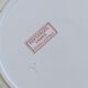 Round antique plate made of pink ironstone, signed Sarreguemines, Fontanges collection.