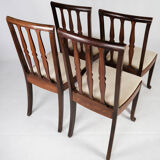 Set of four dining room chairs in rosewood and upholstered with light fabric, 1920s