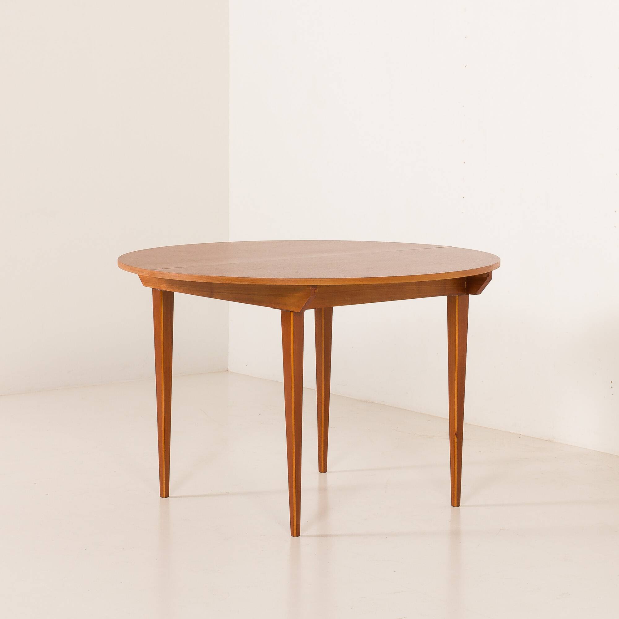 Scandinavian round teak table with hidden extension, 1970s