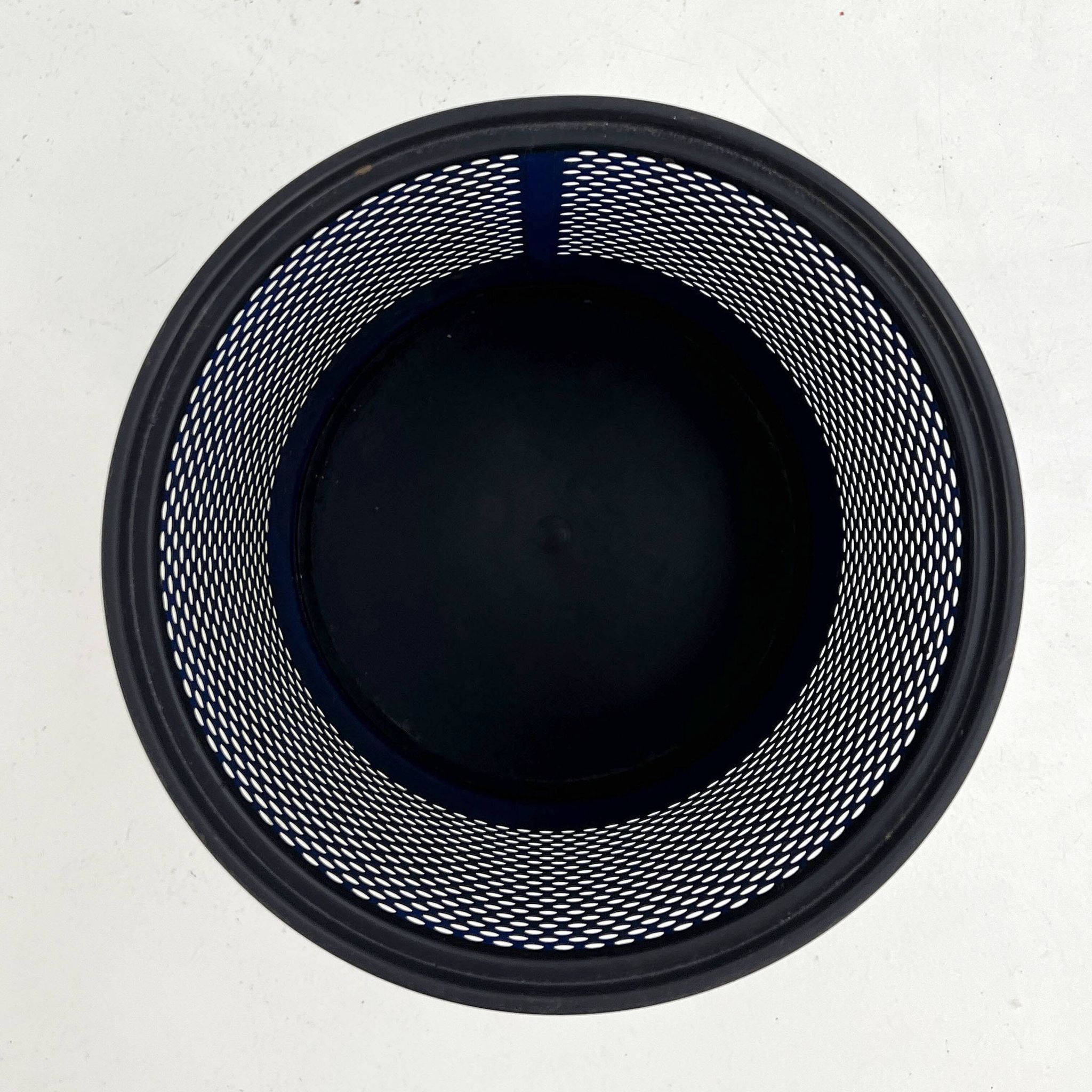 Blue perforated metal bin, 1980