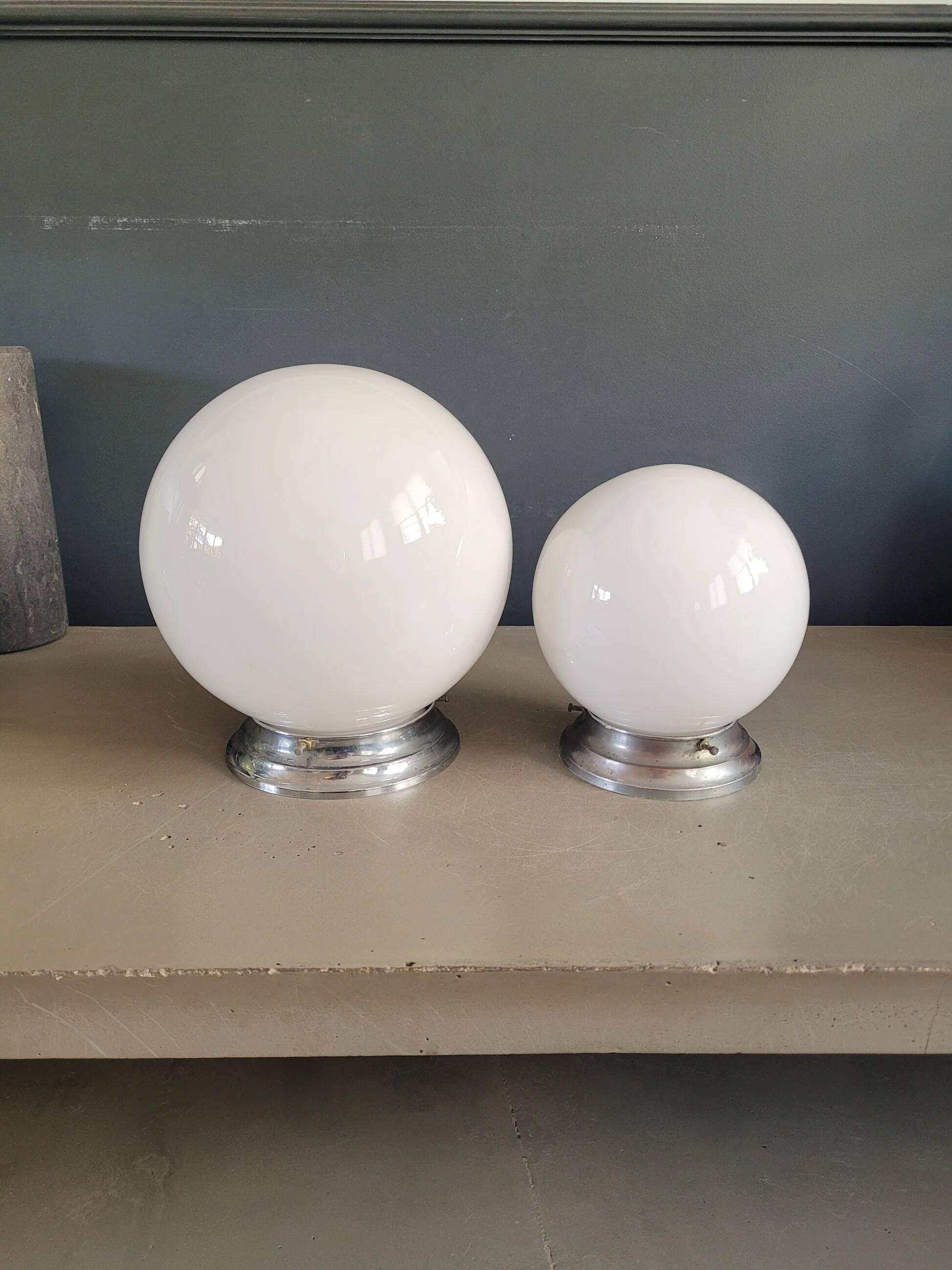 Pair of ceiling lights or wall lights with white glass globes.