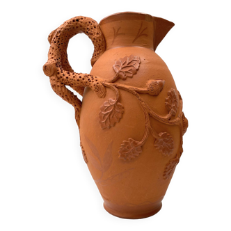 Vintage terracotta jug vase with plant ornament