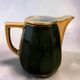 Dark green ceramic decorative jug with golden trim.