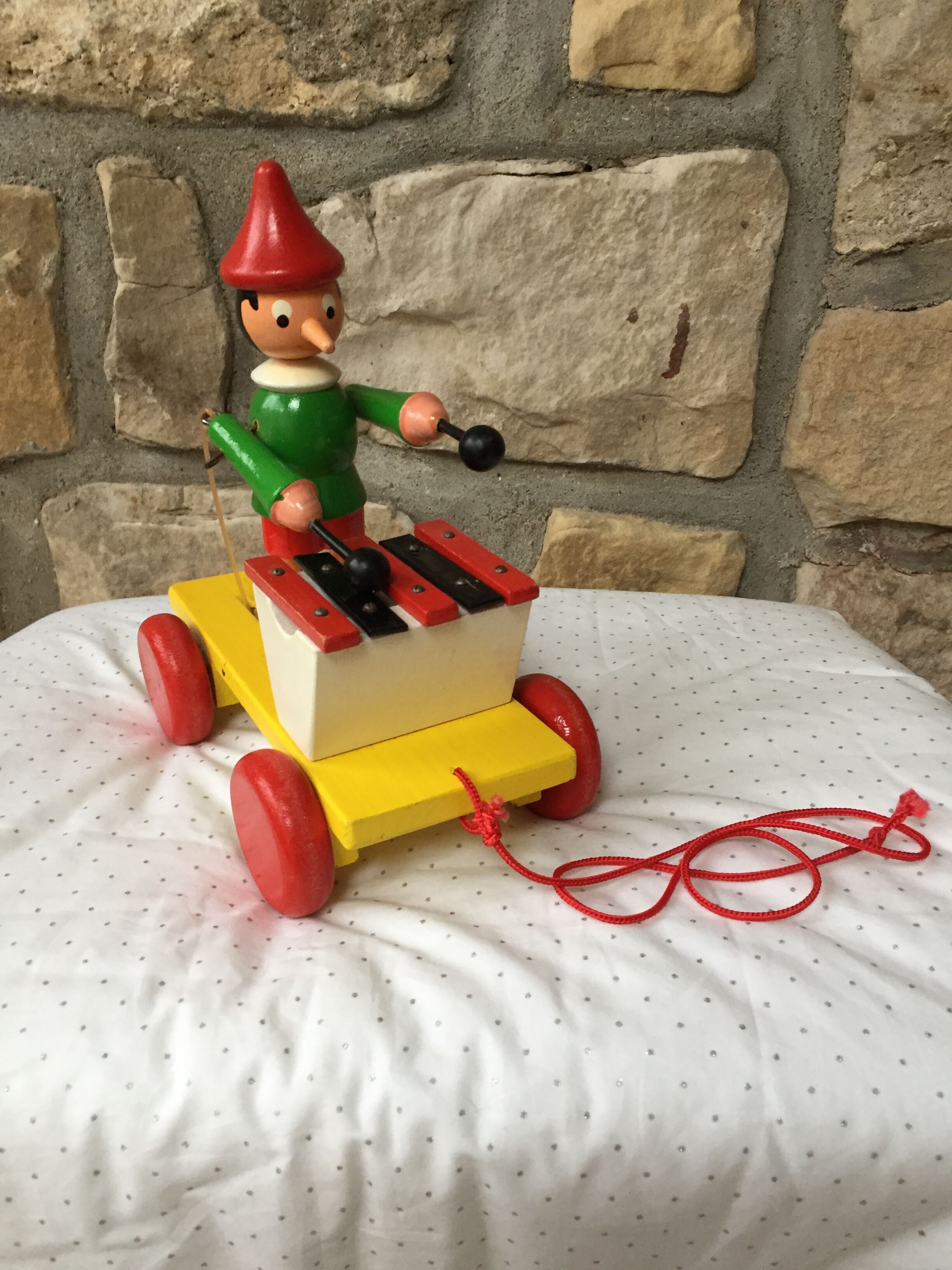 Old toy to pull Pinocchio and his xylophone