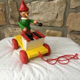 Old toy to pull Pinocchio and his xylophone