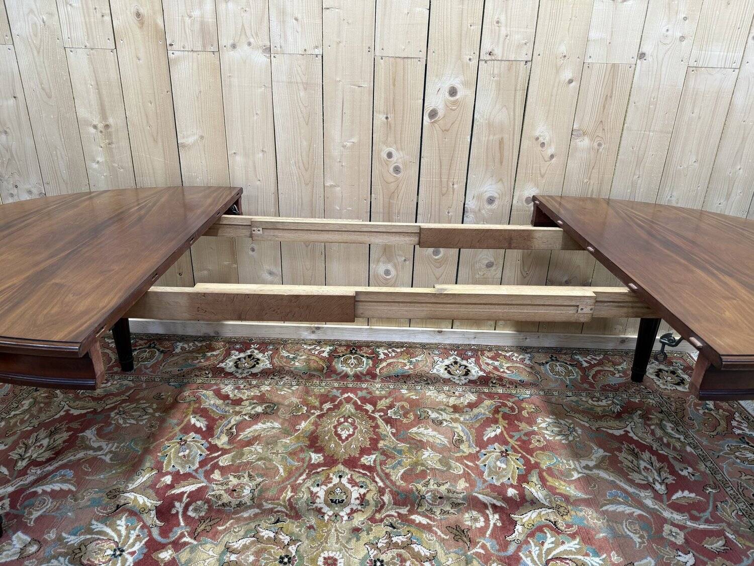 Oval dining table in Louis XVI style made of mahogany.