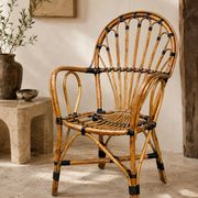 Fauteuil vintage en rotin type paon – années 70
