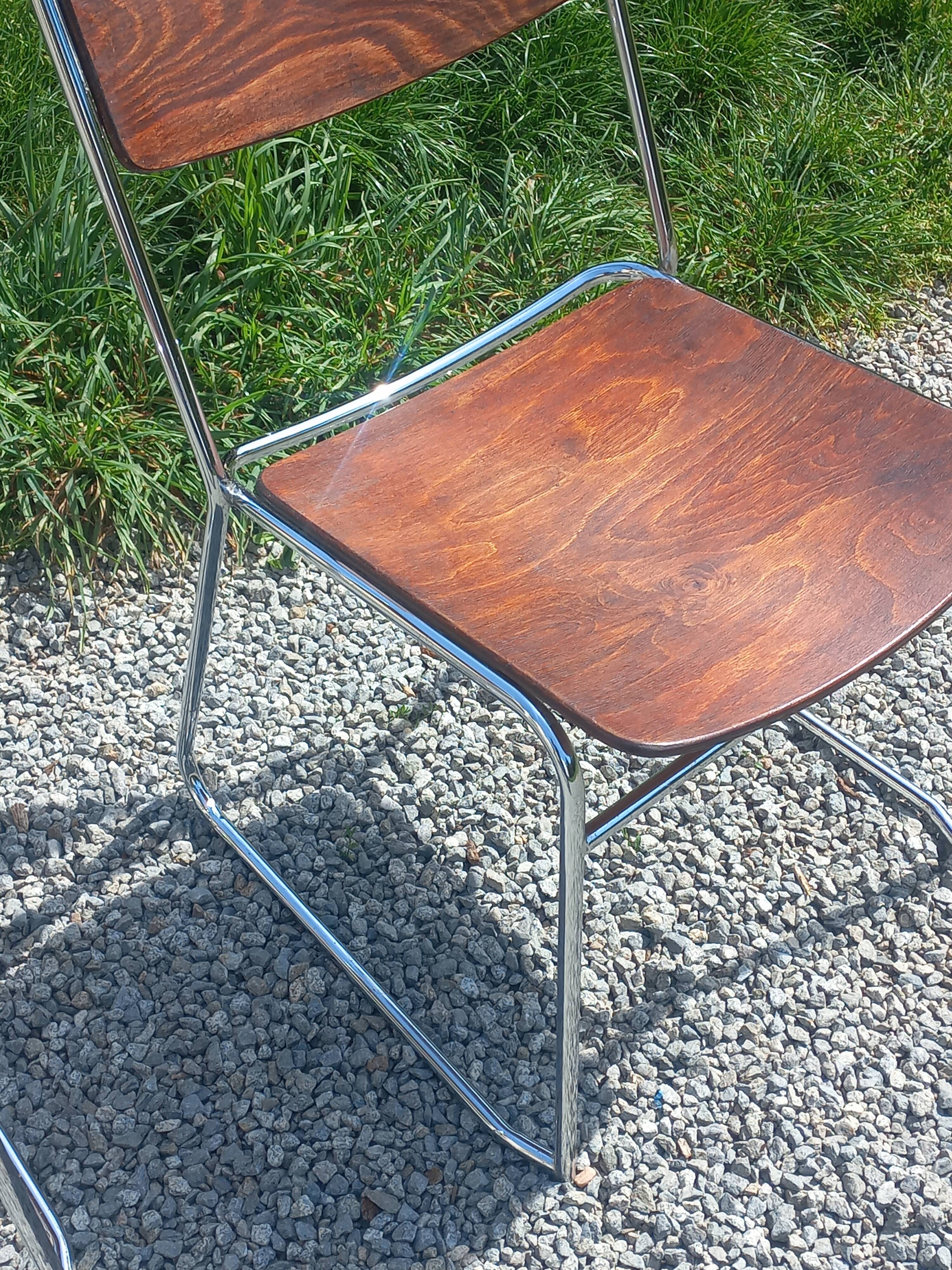Pair of 1970s designer chairs in chrome metal and wood.