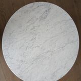 Round marble coffee table with tulip base.