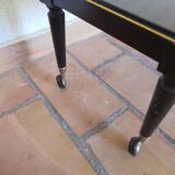 Lacquered coffee table with vintage wheels 70s