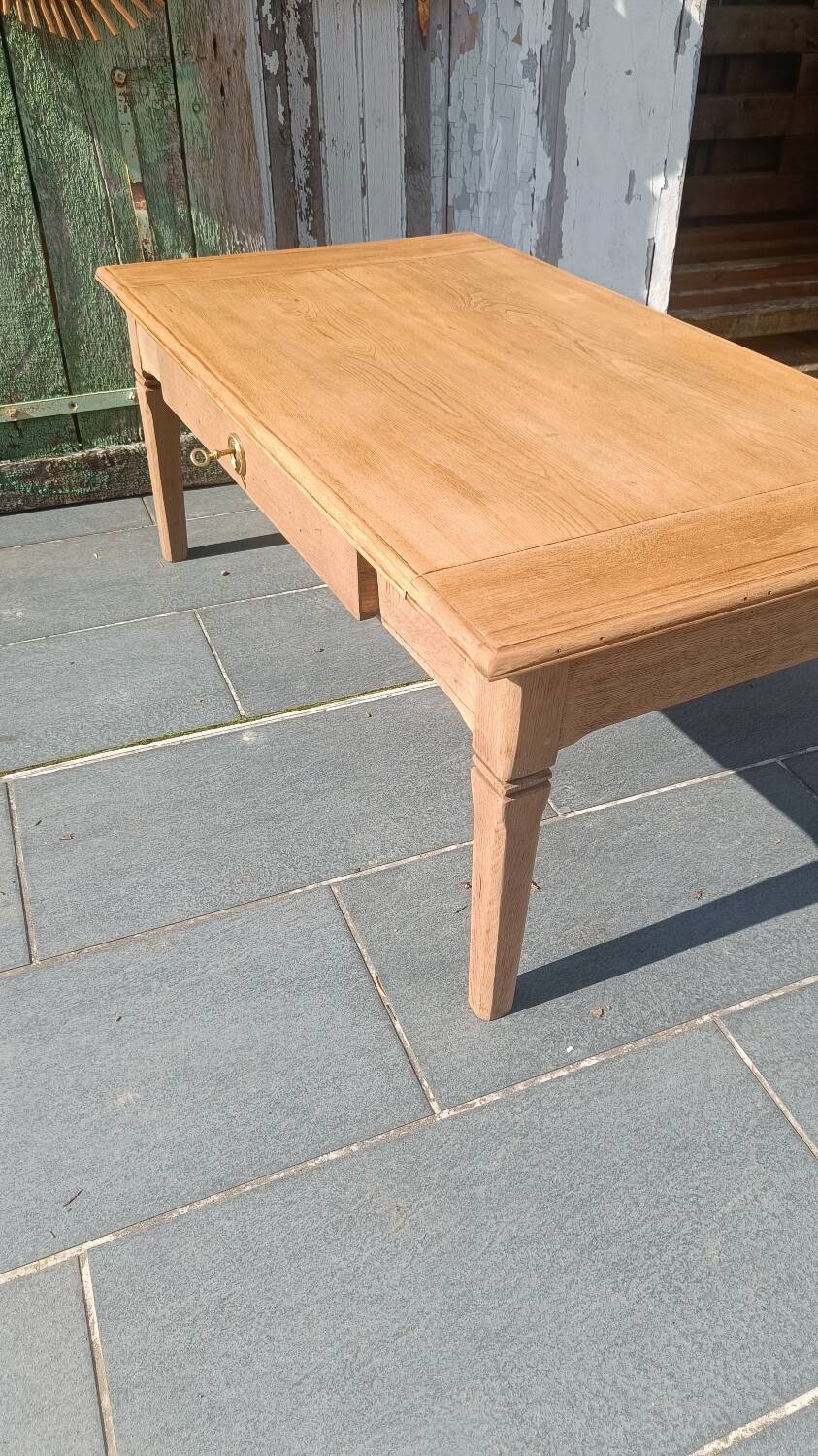 Solid wood coffee table with drawer and original key.