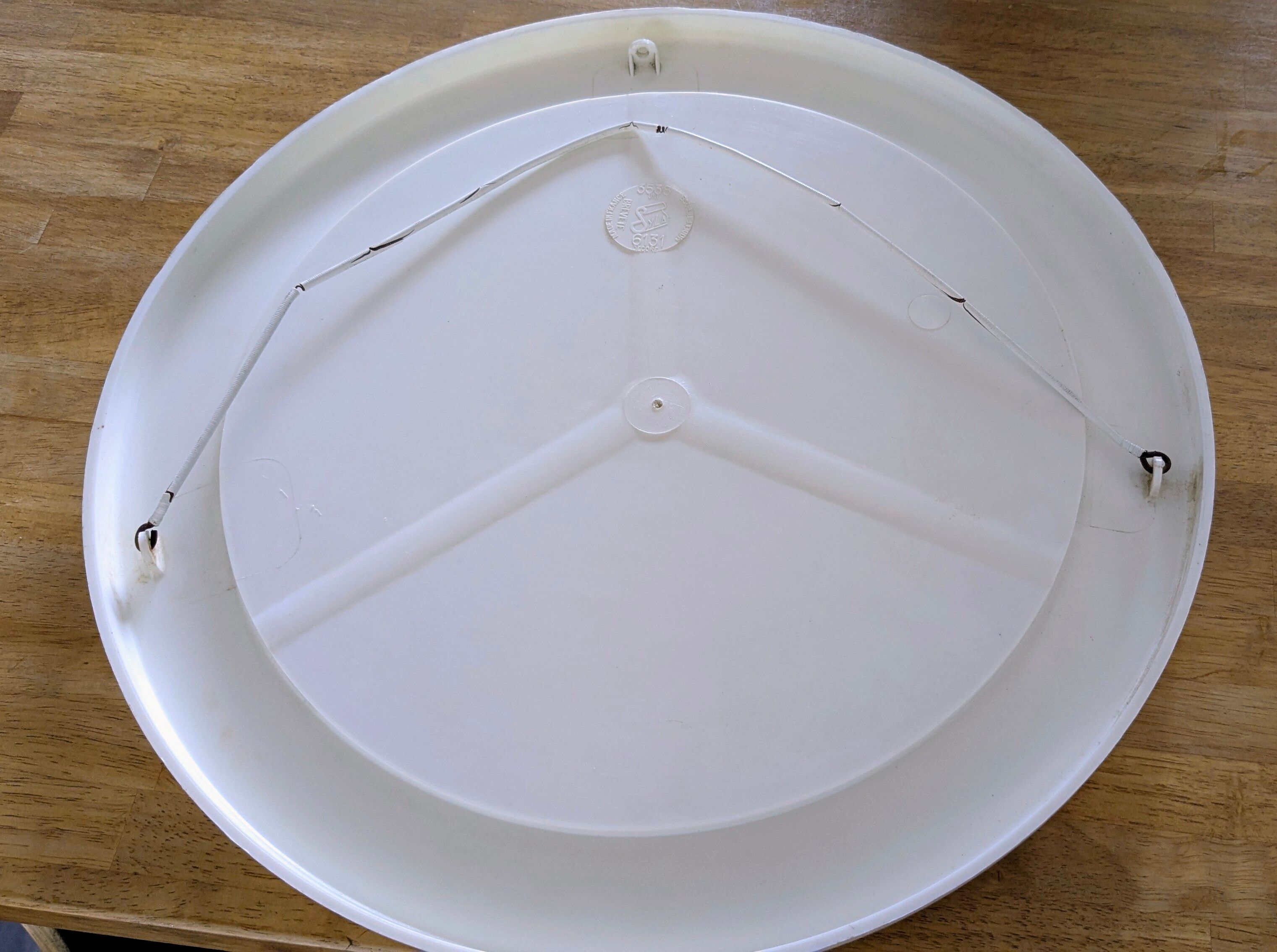 Vintage round mirror Syla model 6131 with rose decoration.