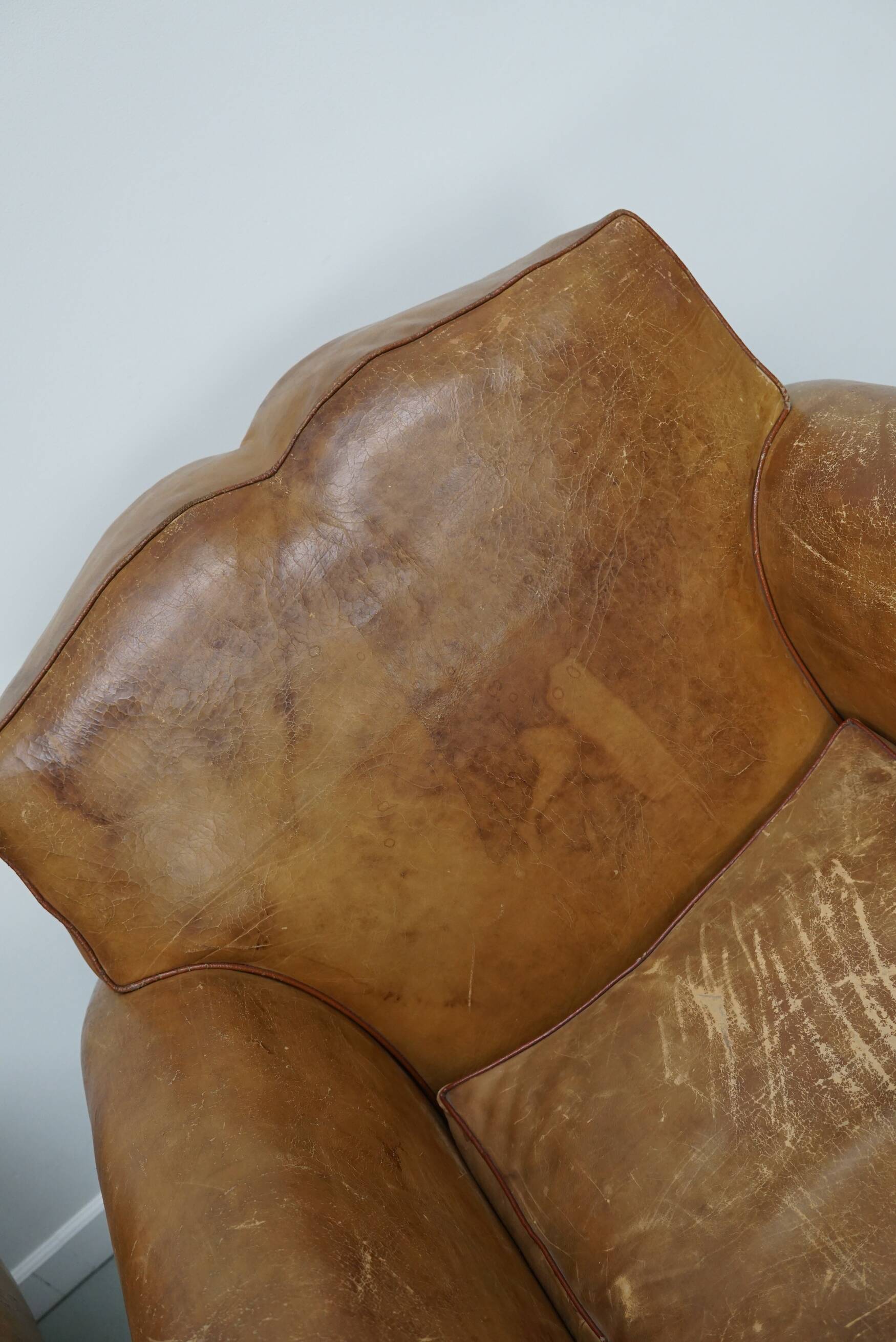 Pair of French club chairs with moustache back in cognac leather, 1940s
