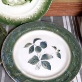 Antique earthenware plates with fruit decoration.