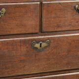 Antique English oak secretary from the 18th century with a stepped interior