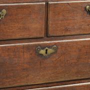 Antique English oak secretary from the 18th century with a stepped interior