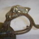 Ancient candlestick in carved bronze ram