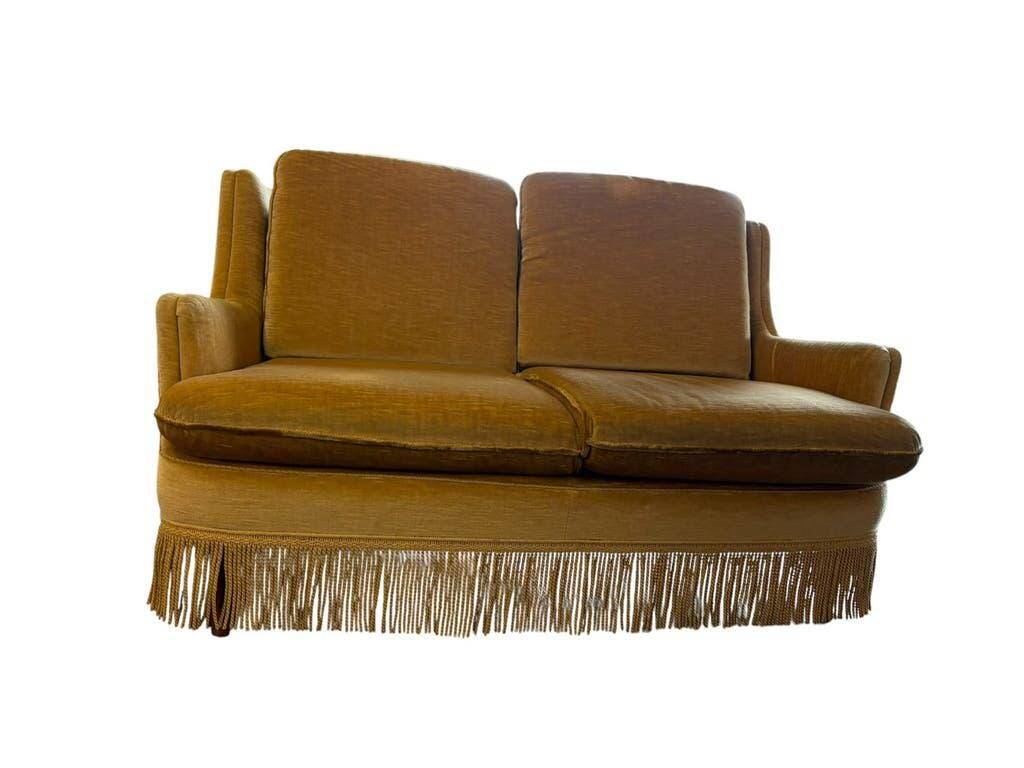 Vintage beige two-seater sofa with fringes