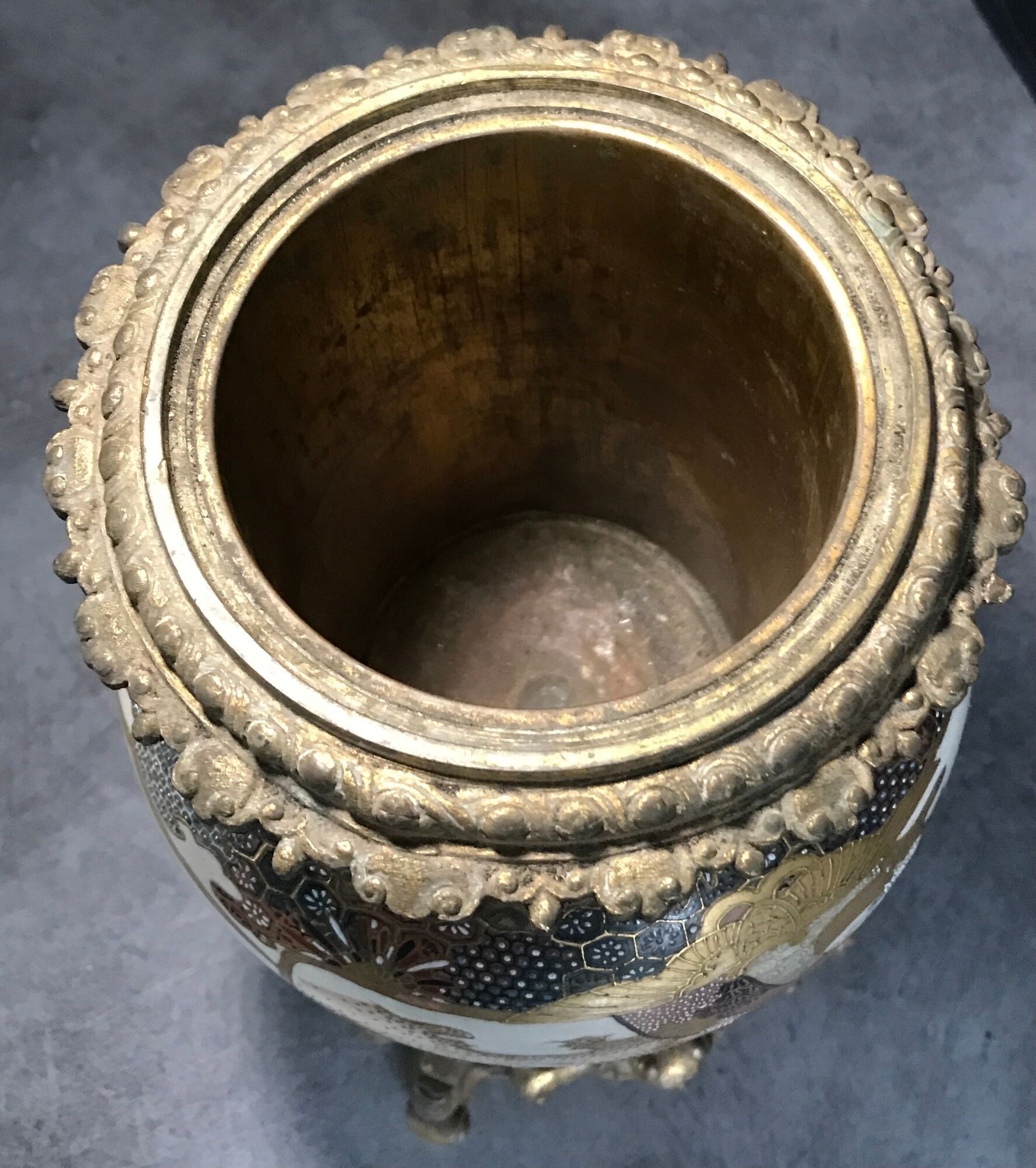 Old satsuma ceramic vase with various decorations mounted on bronze