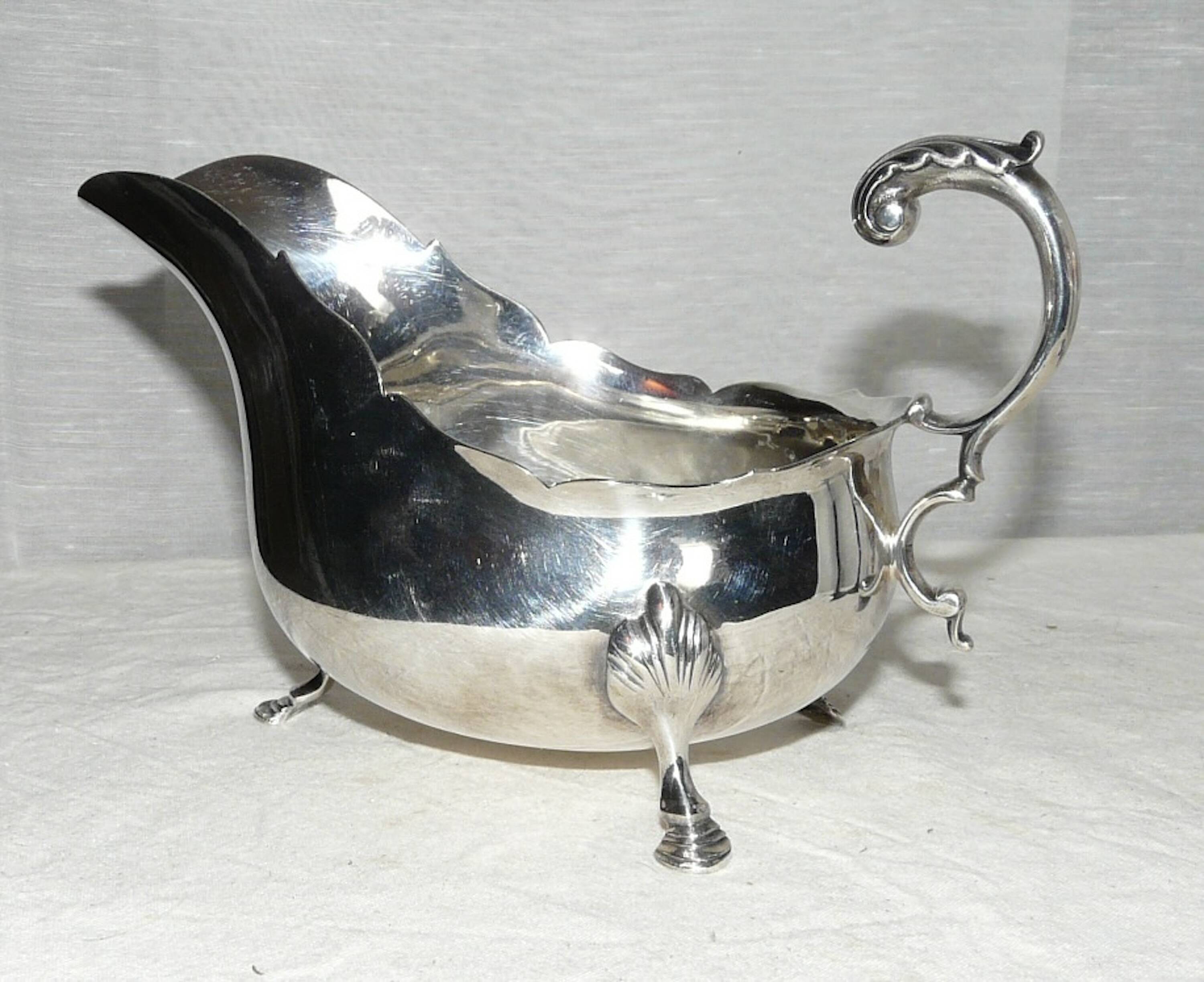 Empire style silver metal sauce boat