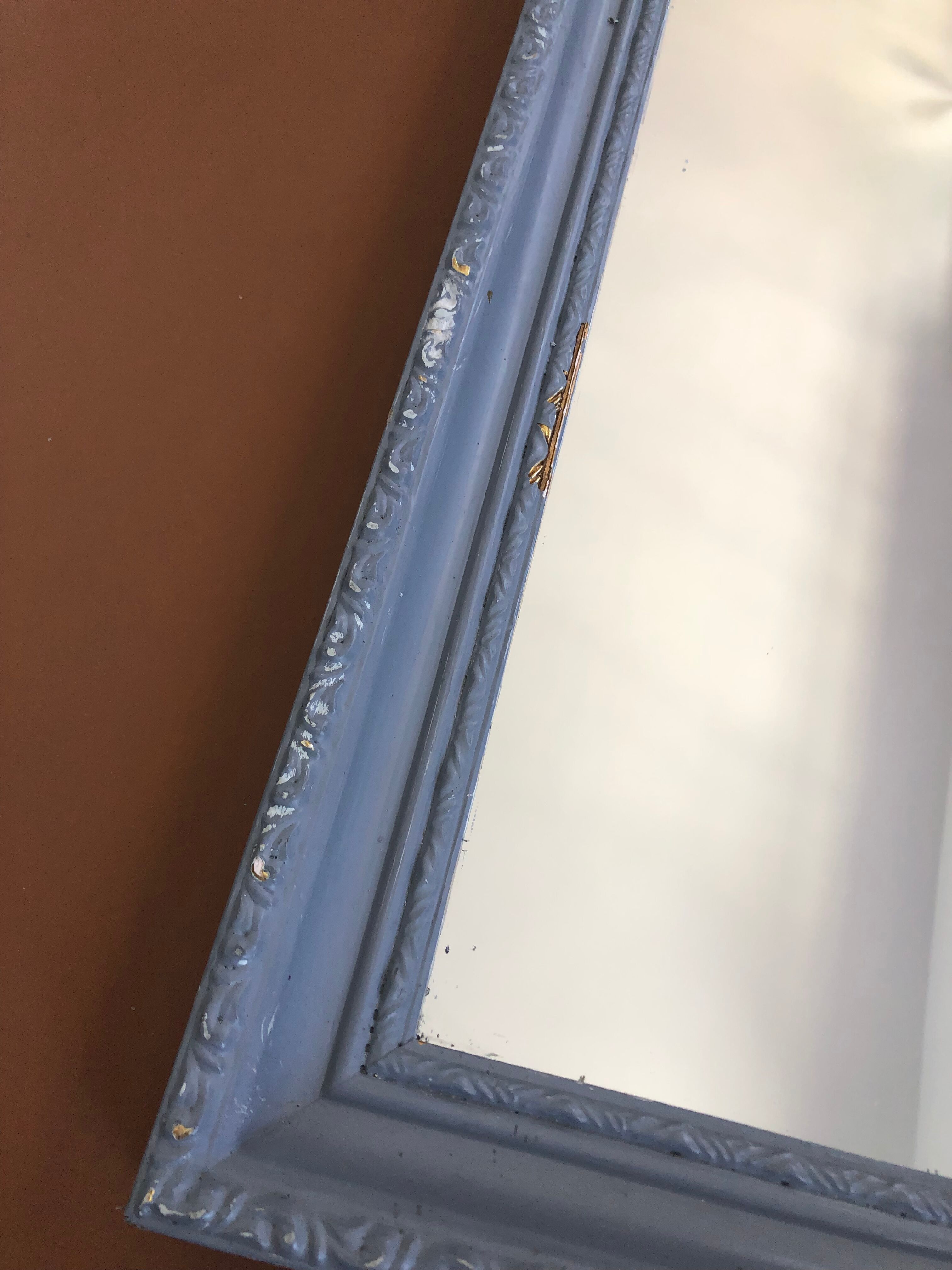 Old patinated mirror golden gray