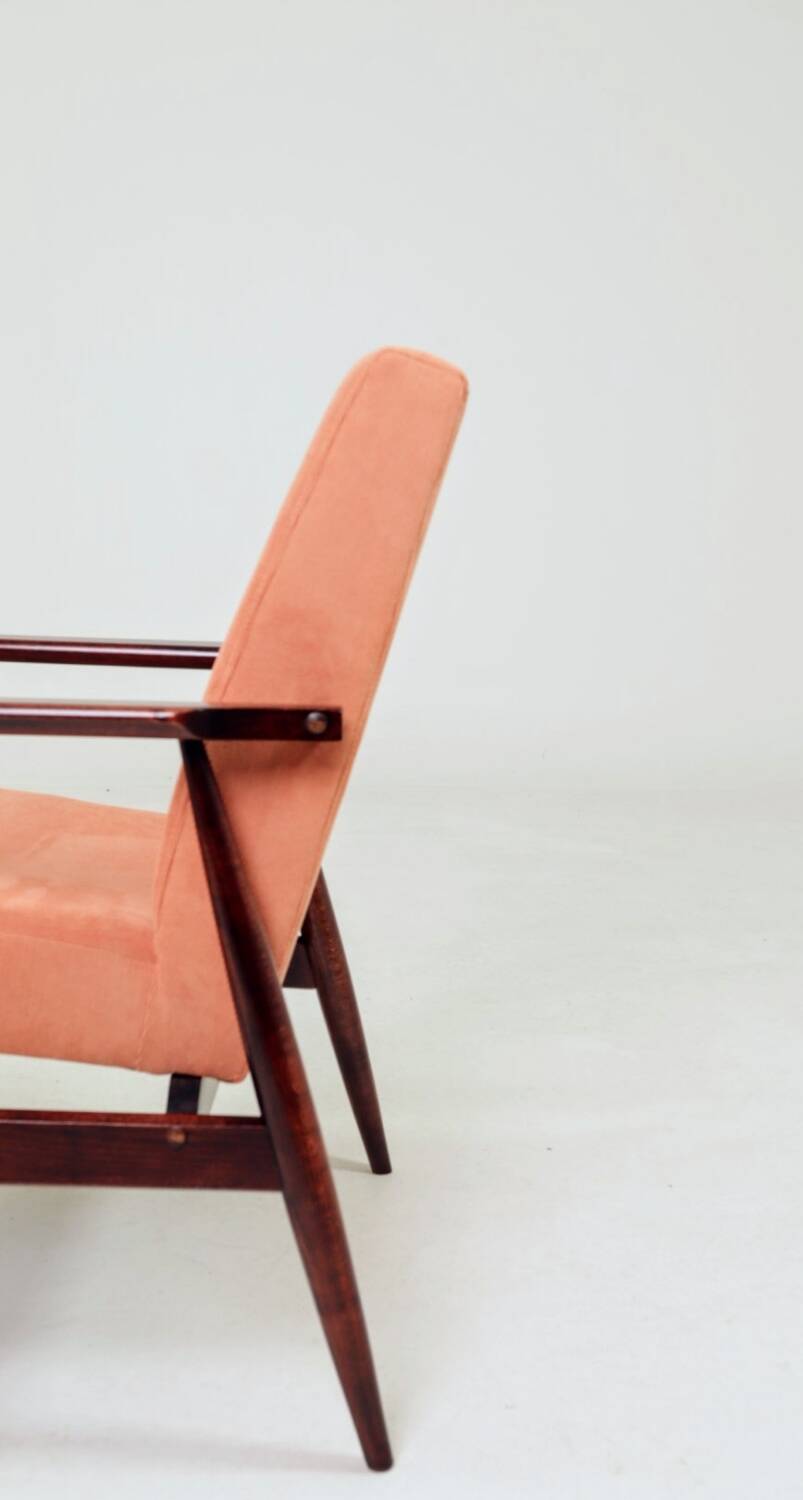 Mid-century modern armchair in coral red designed by H. Lis.