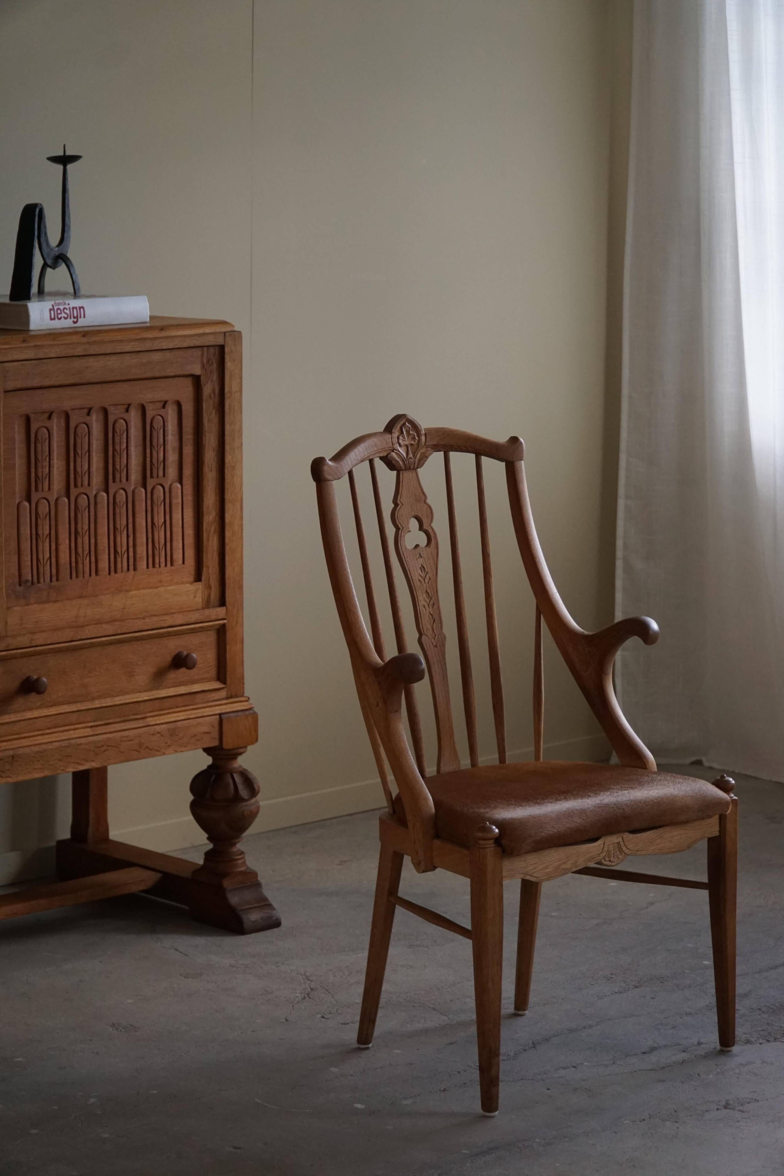 Danish high-back armchair in solid oak with leather cushion, mid-century, 1950s.