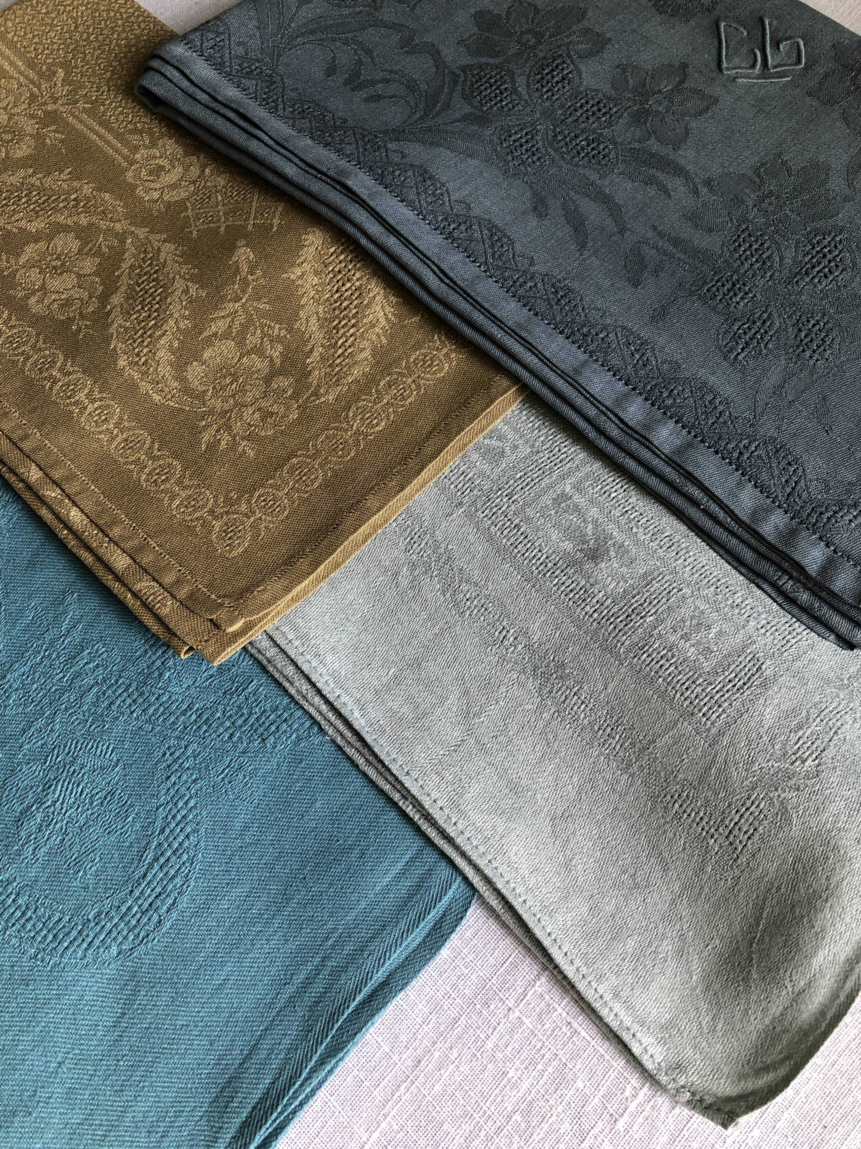 Suite of four tinted antique napkins
