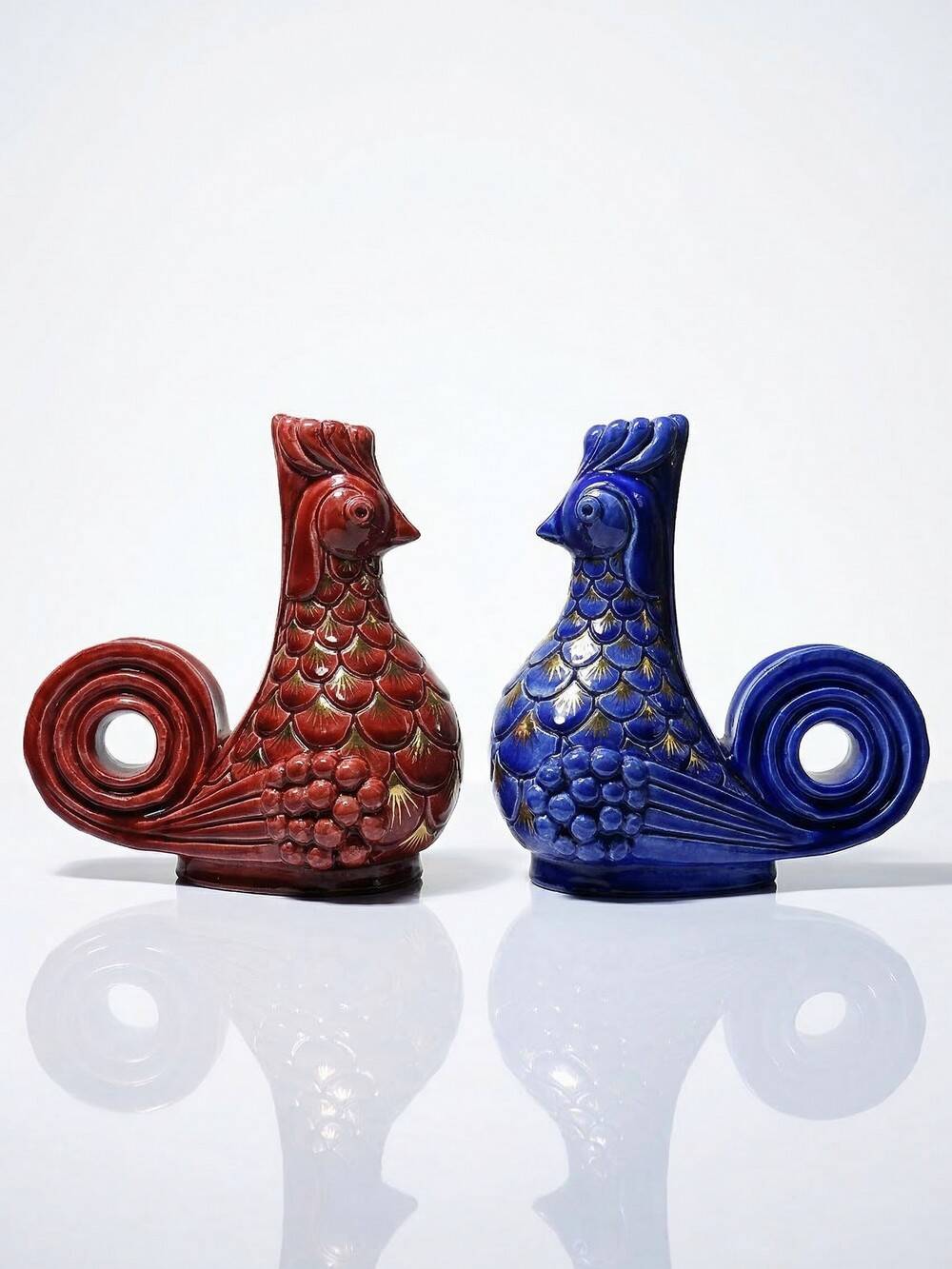 Pair of ceramic glazed candlesticks in the shape of roosters, signed A.G Roger, year 1948.
