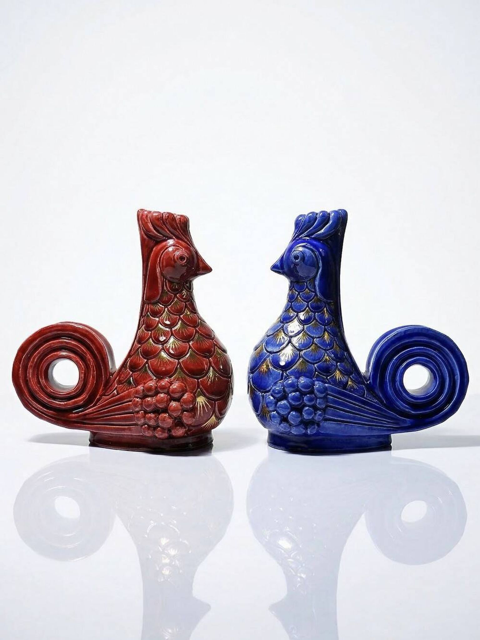 Pair of ceramic glazed candlesticks in the shape of roosters, signed A.G Roger, year 1948.