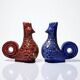 Pair of ceramic glazed candlesticks in the shape of roosters, signed A.G Roger, year 1948.