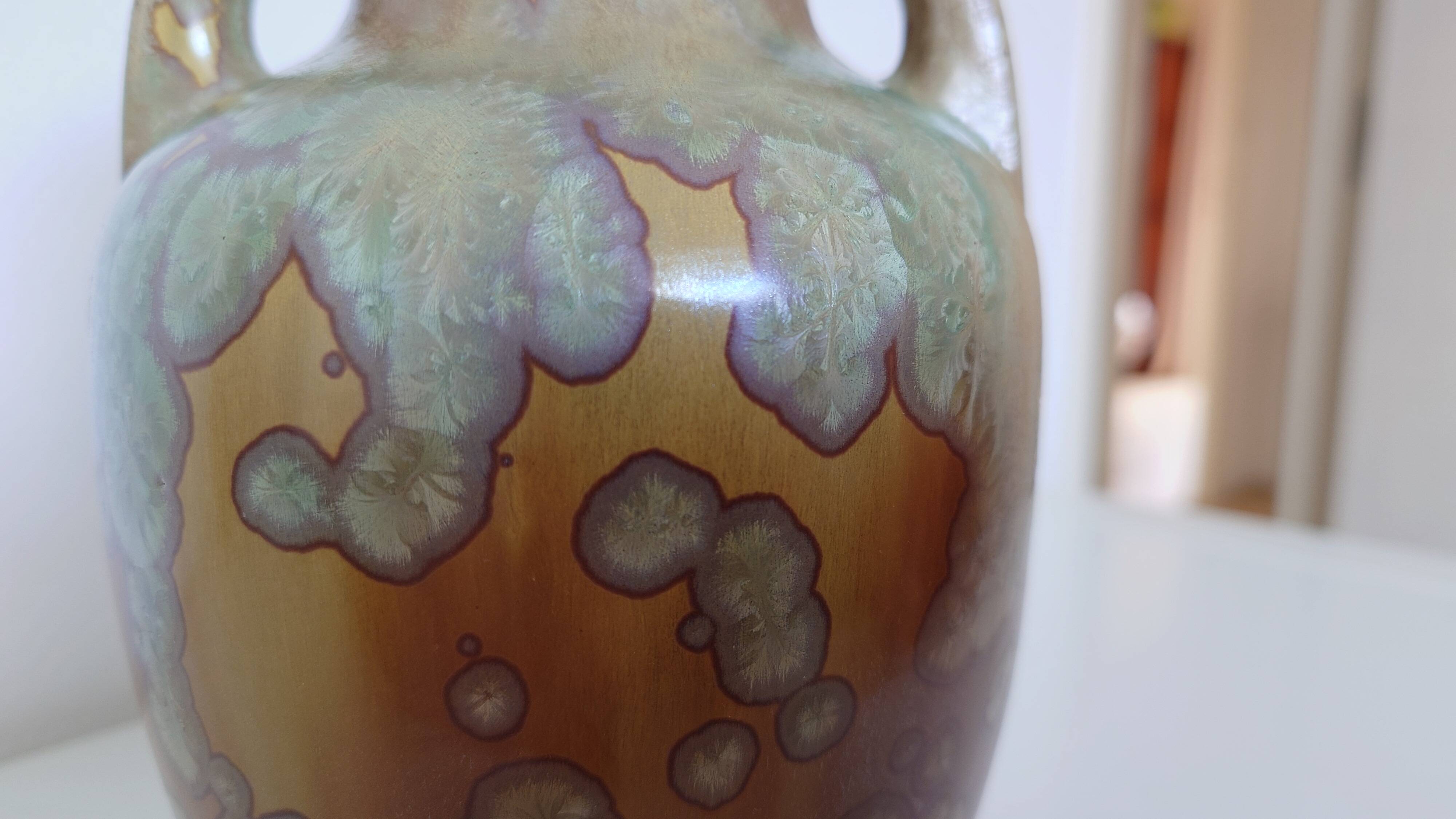 Iridescent crystal-glazed ceramic vase, with two handles, decorative piece.
