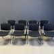 Vintage Italian stackable dining chairs in the style of Castelli, set of 8.