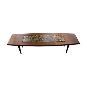 Coffee table with decorative tile.