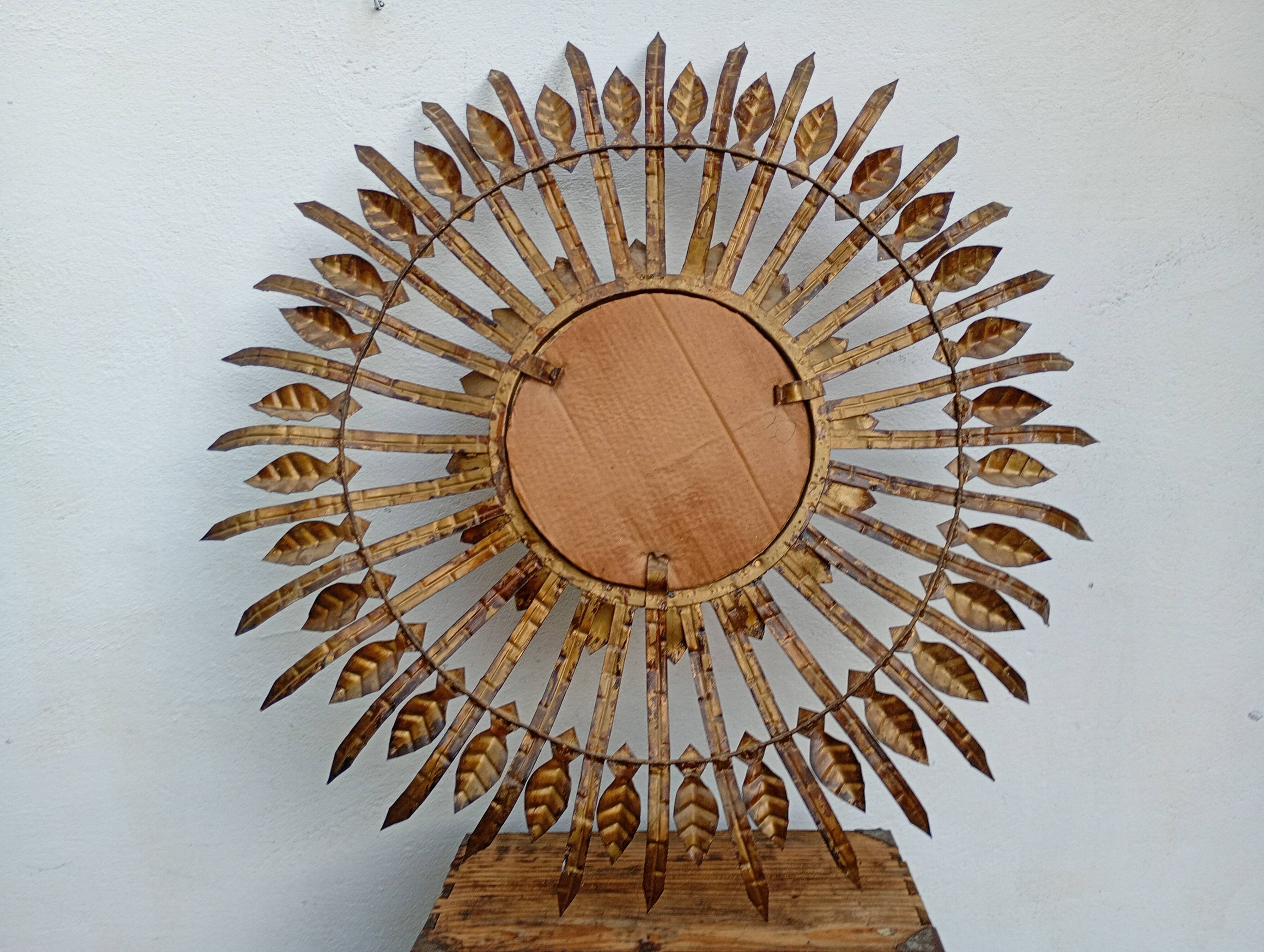 Vintage sun mirror in patinated gold metal – Spain 1950s / 60s