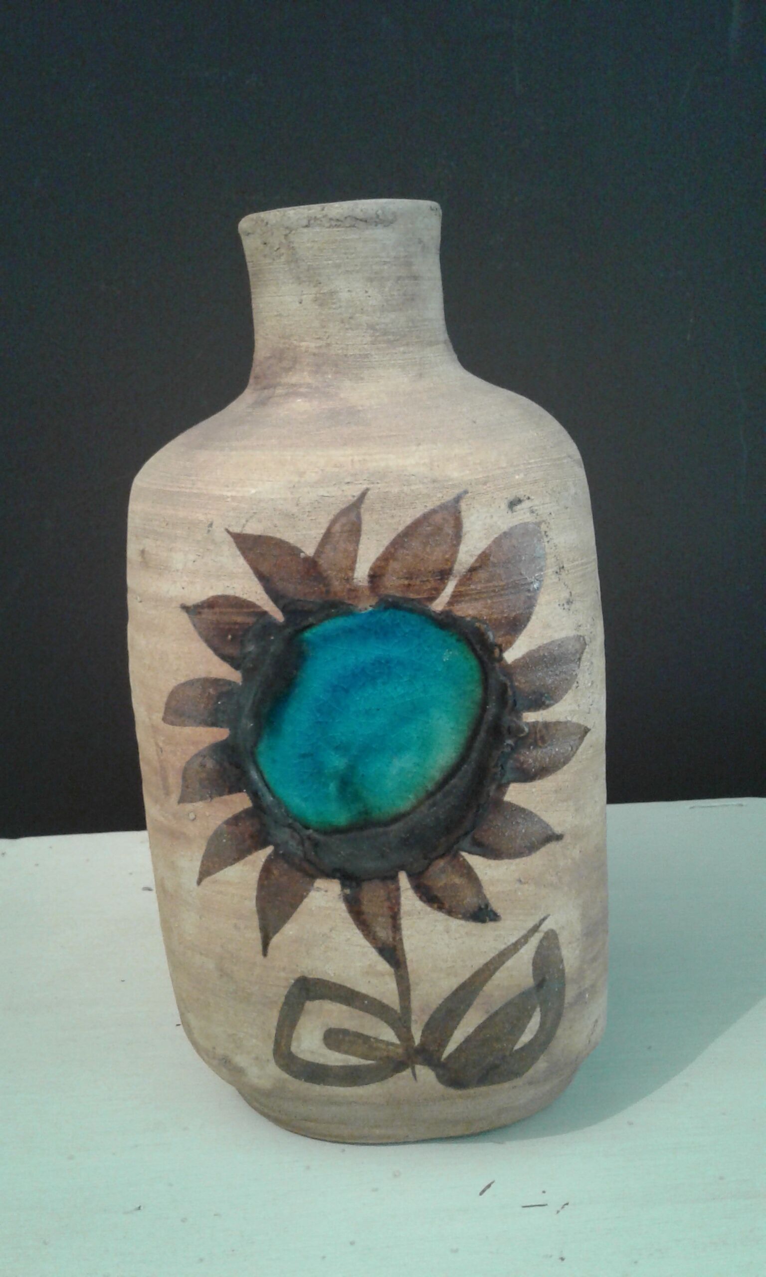 Bottle vase. ceramic enamelled with a flower. Mid-20th. Ht 21.5 cm
