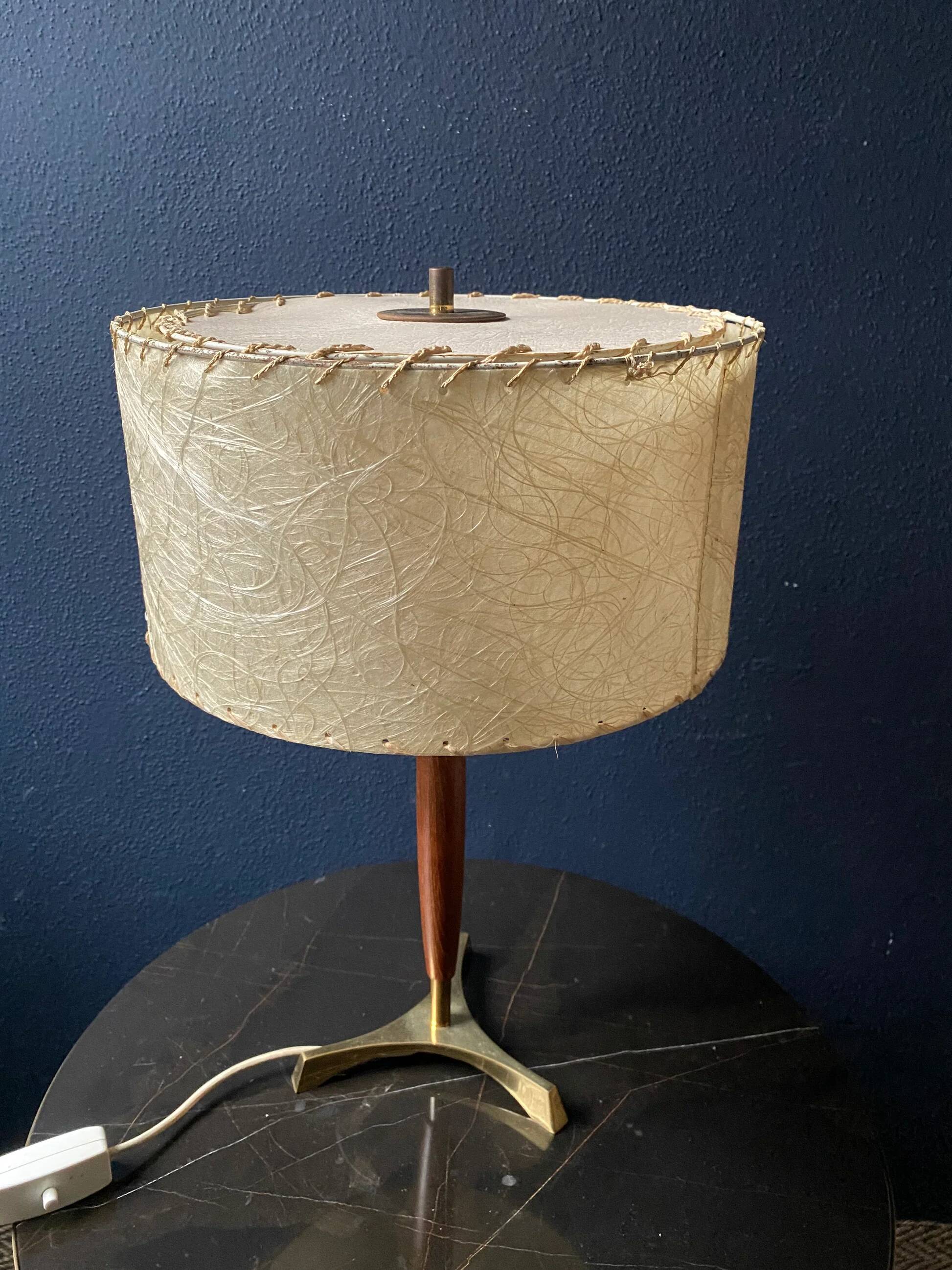 Elegant table lamp with a slender teak body on a tripod brass base, Germany, 1960s.