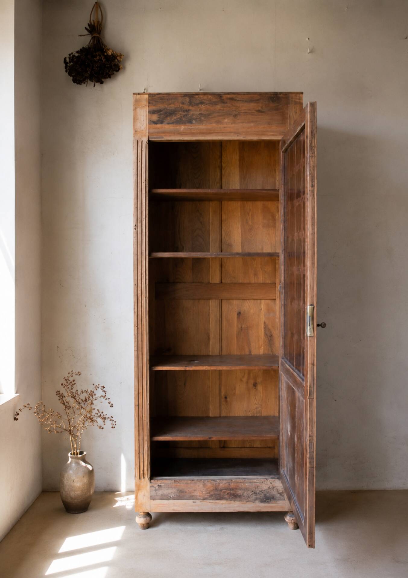 Glass-fronted cabinet from 1915, solid wood.